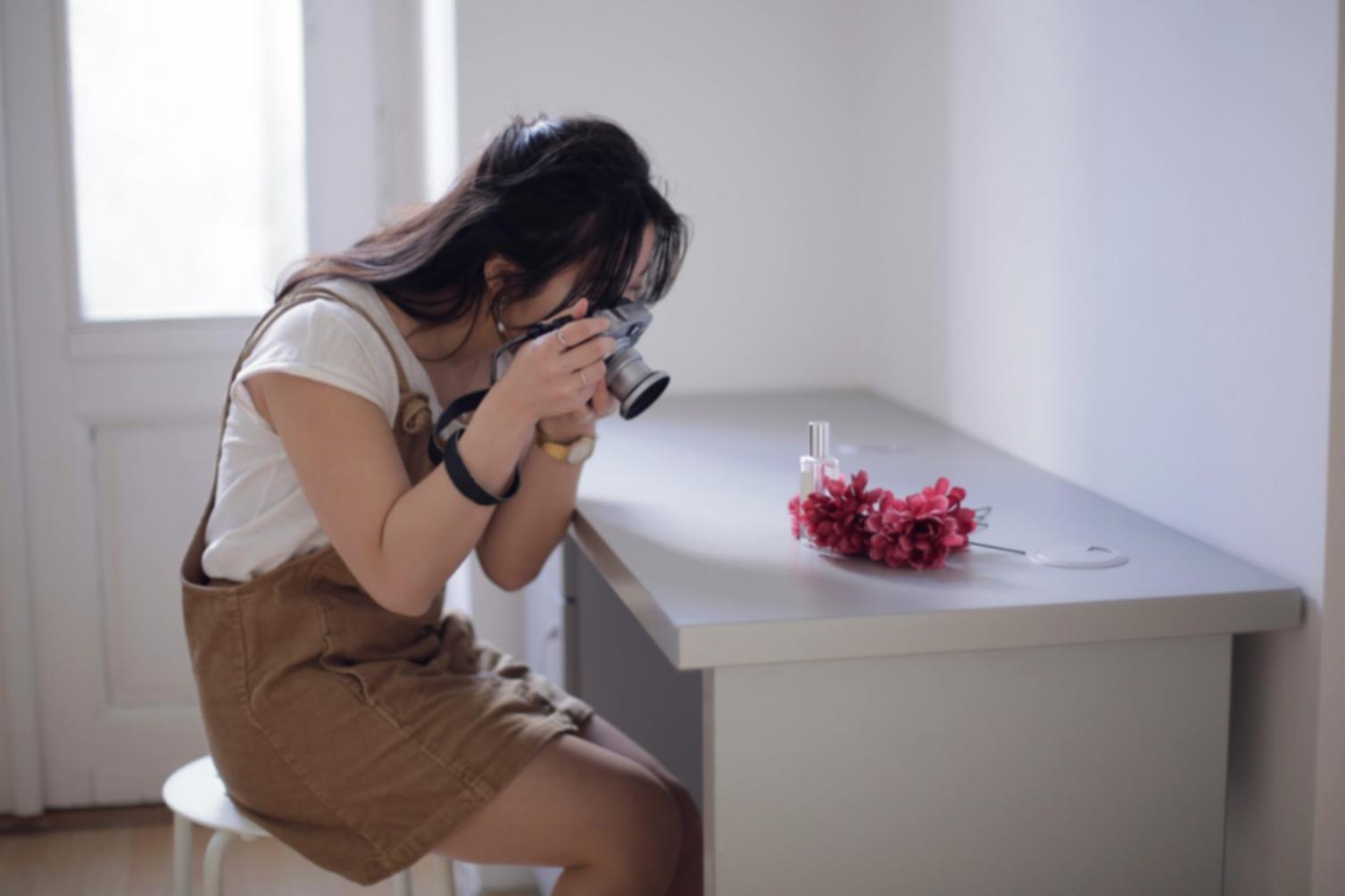 Photographer studying composition principles through structured framing exercises